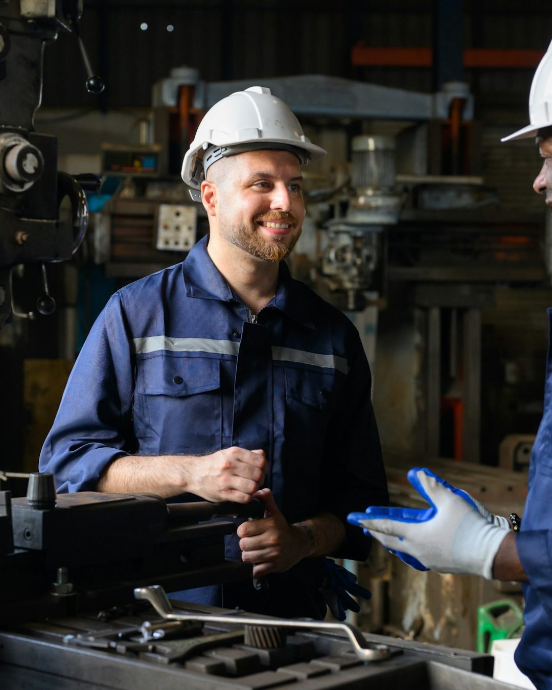 Two industrial engineers team with safety uniform